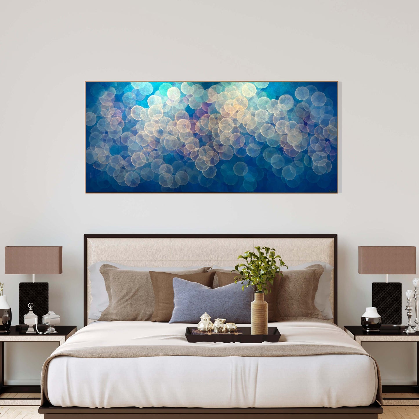 The colour palette is subtle yet captivating, with delicate pastel tones blending seamlessly together. Soft shades of lavender, blush pink, and sky blue imbue the artwork with a sense of warmth and comfort, while hints of gold add a touch of luminosity and depth. Original art by Australian abstract artist Jo Carroll. Shown in elegant bedroom.